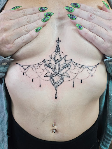 Explore dog print tattoo ideas, creative tattoo ideas in Clarkston, available at Rogue Tattoo