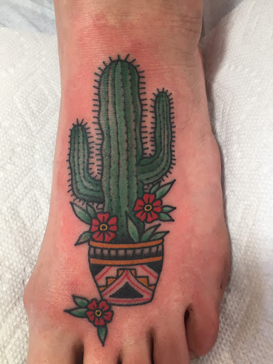 Explore american traditional chest tattoo ideas, creative tattoo ideas in Taos, available at Magical Tattoo