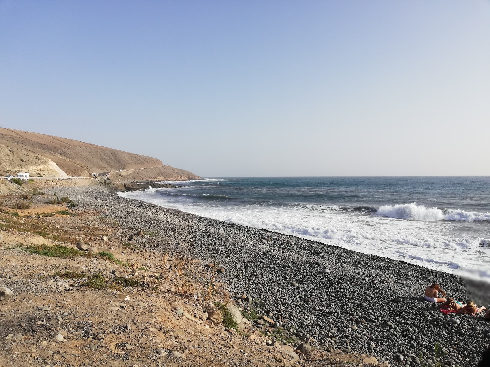 Foto av Playa de las Carpinteras med harmaa hiekka ja kivi yta