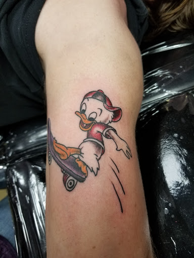 Explore female throat tattoo ideas, creative tattoo ideas in Powell, available at AVALON COVE TATTOO