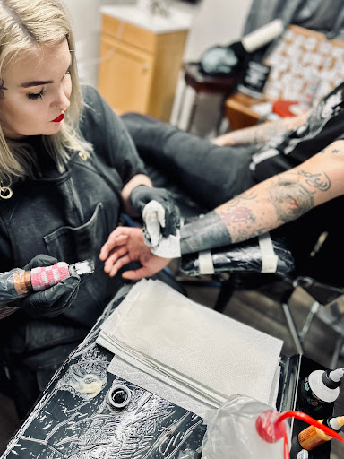 Explore tattoo ideas for women's lower back, creative tattoo ideas in Enid, available at Tangent Wallflower Tattoo