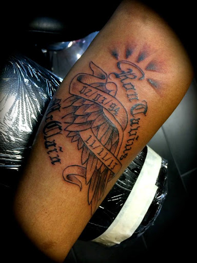 Explore loyalty over love tattoo ideas, creative tattoo ideas in Camden, available at The Golden Goose Tattoo Studio