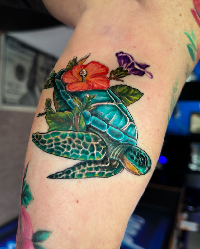 Explore women's spine tattoo ideas, creative tattoo ideas in West Union, available at Status Tattoo
