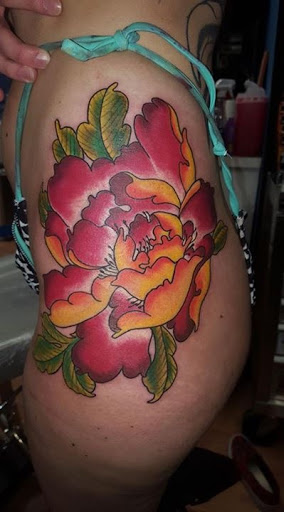 Explore wildflower tattoo ideas, creative tattoo ideas in Bridgeport, available at Physical Grafitti Tattoo