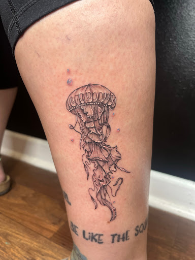 Explore thigh tattoo cover up ideas, creative tattoo ideas in Foley, available at Emerald Ink Tattoos by Victoria