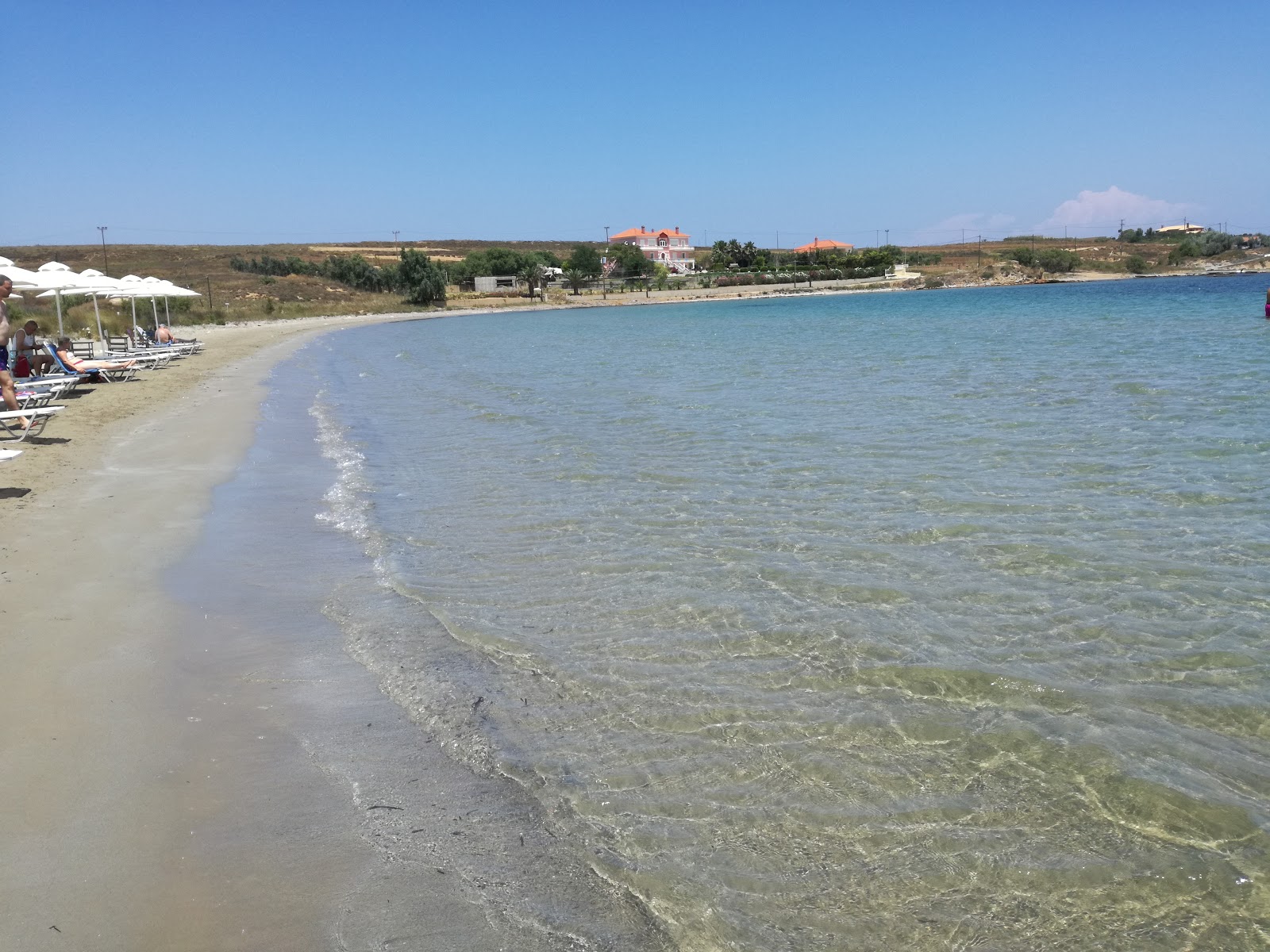 Kotsinas beach'in fotoğrafı turkuaz saf su yüzey ile