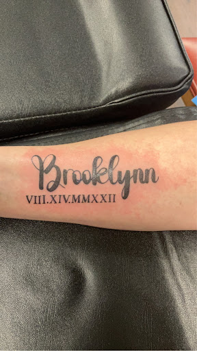 Find women's rib tattoo ideas for your next unique tattoo in Kewanee at Splat Ink tattoos and piercings