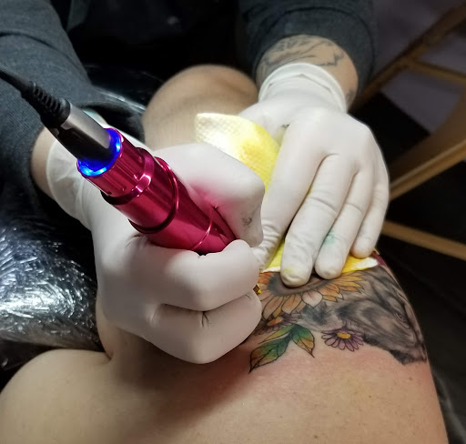 Explore tattoo ideas for women in arm, creative tattoo ideas in Scottsboro, available at Mad Tatters Tattoo & Body Piercing