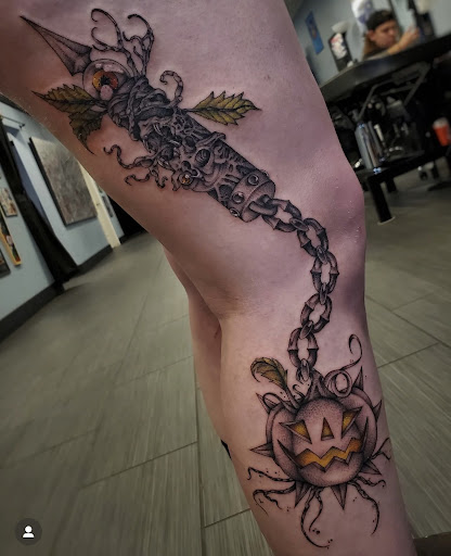 Explore cover up tattoo ideas for upper arm, creative tattoo ideas in Palm Harbor, available at Angry Owl Tattoo and Piercing