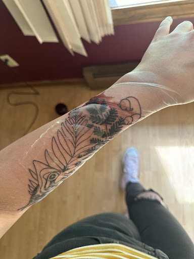 Explore crystal ball tattoo ideas, creative tattoo ideas in Forest Lake, available at Electric Blue Tattoo Co.