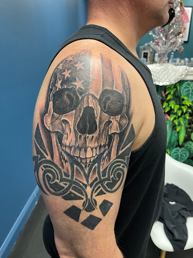 Explore arm tattoo ideas womens, creative tattoo ideas in Grand Island, available at The Shaded Dahlia Piercing & Tattoo Parlor