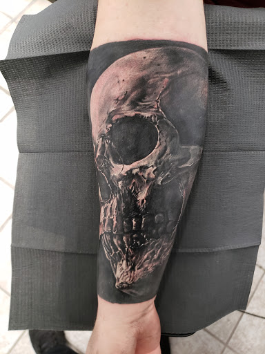 Explore small behind ear tattoo ideas, creative tattoo ideas in Warren, available at Dark Horse Tattoo Co. LLC.