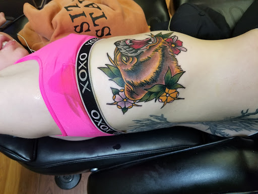 Explore red cardinal tattoo ideas, creative tattoo ideas in Chicago, available at Mind Crusher Tattoo