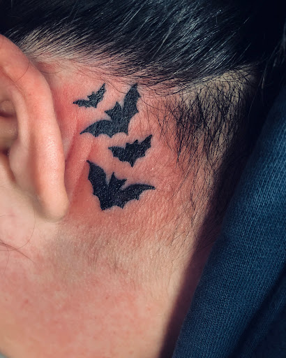 Explore kissing lips tattoo ideas, creative tattoo ideas in North Tonawanda, available at Dark Side Ink Tattoo Studio