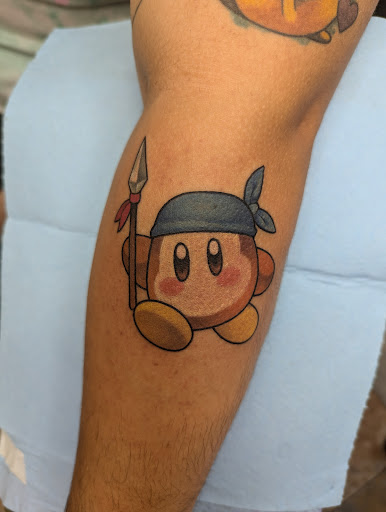 Explore women thigh tattoo ideas, creative tattoo ideas in Green Bay, available at The Blue Gem Tattooing