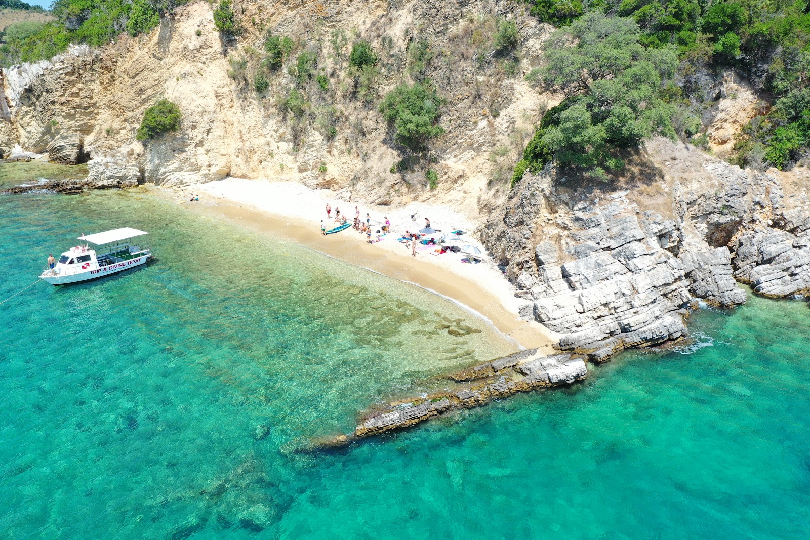 Foto von Tongo Beach mit beiger sand Oberfläche