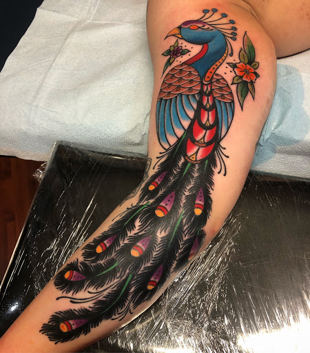 Explore triangle tattoo ideas, creative tattoo ideas in Tampa, available at HAWKS ELECTRIC TATTOOS