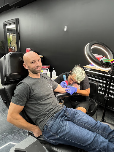 Explore hand tattoos ideas for men, creative tattoo ideas in Hollywood, available at Sacred Eye Tattoos