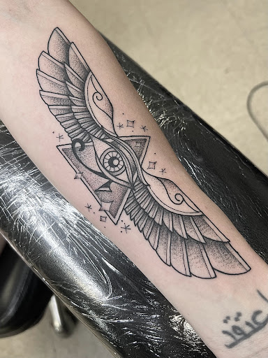Explore wisdom tattoo ideas, creative tattoo ideas in Elkin, available at Black Bear Tattoo