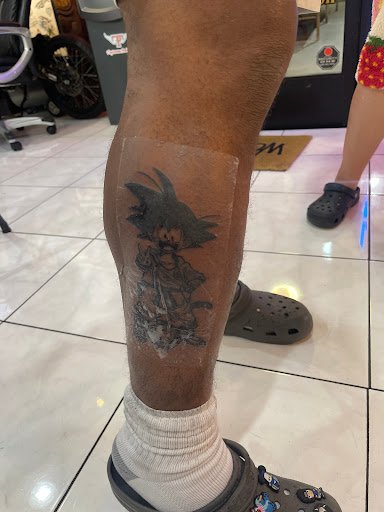 Explore mens back tattoo ideas, creative tattoo ideas in Honolulu, available at Sacred Art Tattoo Waikiki