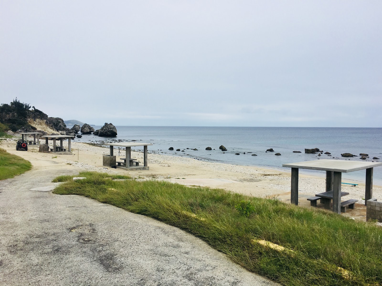 Foto di Chapman beach con una superficie del ciottolo grigio