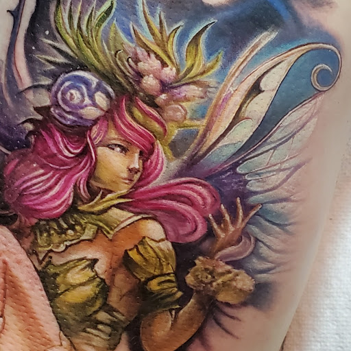 Find alpha and omega tattoo ideas for your next unique tattoo in Pueblo at Spellbound Electric Tattoos