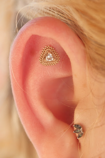 Explore maple leaf tattoo ideas, creative tattoo ideas in Buffalo, available at Moria Piercing and Jewelry