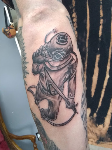 Find earth sign tattoo ideas for your next unique tattoo in Moline at Bleeding Art Studio
