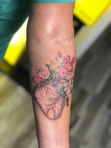 Find tattoo ideas for under the breast for your next unique tattoo in Ocala at The Tattoo Gallery of Ocala LLC