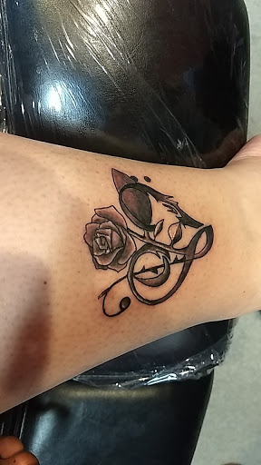 Explore small behind ear tattoo ideas, creative tattoo ideas in Salida, available at Integrity Tattoo