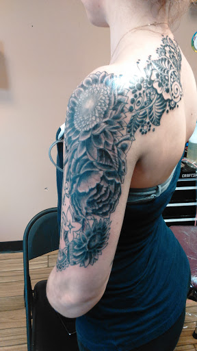 Explore hand tattoo ideas for woman, creative tattoo ideas in Newport, available at T N T Explosive Tattoo