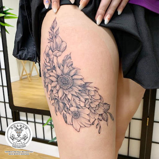 Find inbetween boob tattoo ideas for your next unique tattoo in Seattle at Dragon Tattoo