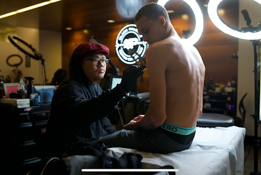 Explore lower back tattoo ideas for men, creative tattoo ideas in Honolulu, available at Black Palette Tattoo & Piercing