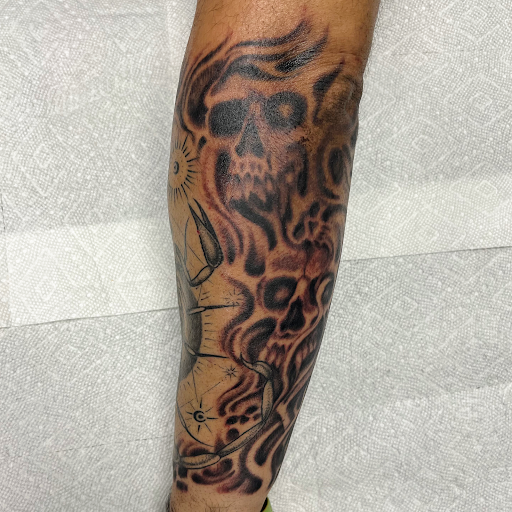 Explore religious elbow tattoo ideas, creative tattoo ideas in Georgetown, available at Iron Rite Tattoo South