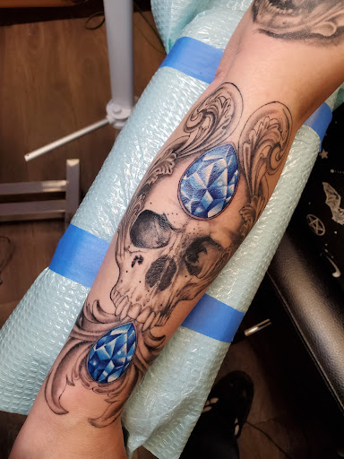 Explore lip tattoo ideas for men, creative tattoo ideas in Peoria, available at Guerrilla Ink Tattoos