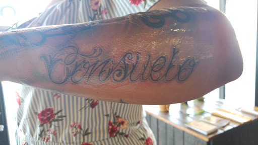 Explore arm tattoo ideas flowers, creative tattoo ideas in Orlando, available at Good Vibrations Ink Tattoo and Body Piercing