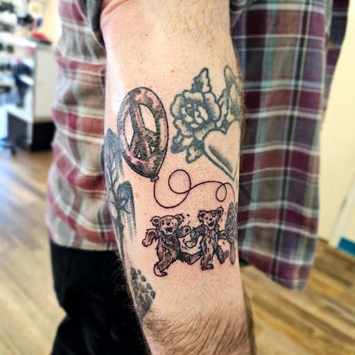 Explore gravestone tattoo ideas, creative tattoo ideas in Traverse City, available at Pinups & Needles
