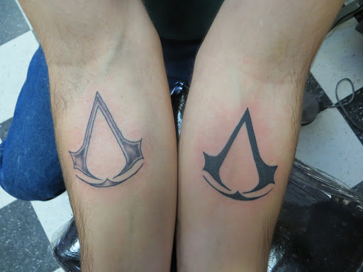 Explore hand tattoo ideas men, creative tattoo ideas in Powell, available at AVALON COVE TATTOO