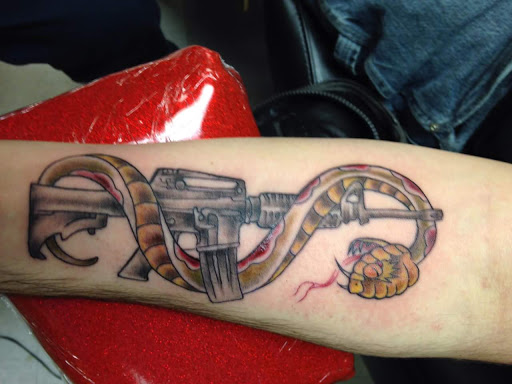 Explore lady justice tattoo ideas, creative tattoo ideas in Cheyenne, available at The T.R.I.B.E. Zoo, LLC Tattoo