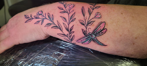 Explore griffin tattoo ideas, creative tattoo ideas in Angola, available at Hoodlum Ink