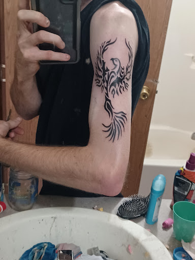 Explore hairdresser tattoo ideas, creative tattoo ideas in Warrensburg, available at The Zone Tattoo & Body Piercing