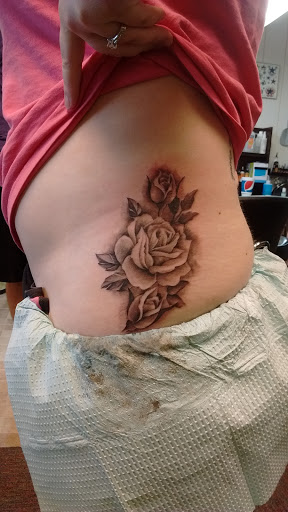 Explore tattoo name cover up ideas on wrist, creative tattoo ideas in Decatur, available at Exclusive Ink Tattoos & Body Piercings 22nd & Wood