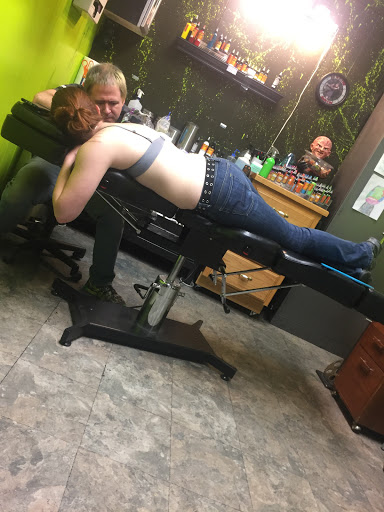 Explore tattoo cover up ideas for upper back, creative tattoo ideas in Overland Park, available at Aftershock Tattoo Co.