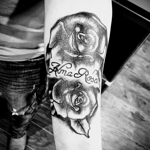 Explore flower arm tattoo ideas, creative tattoo ideas in Denison, available at Crossroads Tattoo Studio