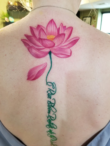 Explore tattoo behind ear ideas, creative tattoo ideas in Fargo, available at Tailwind Tattoo