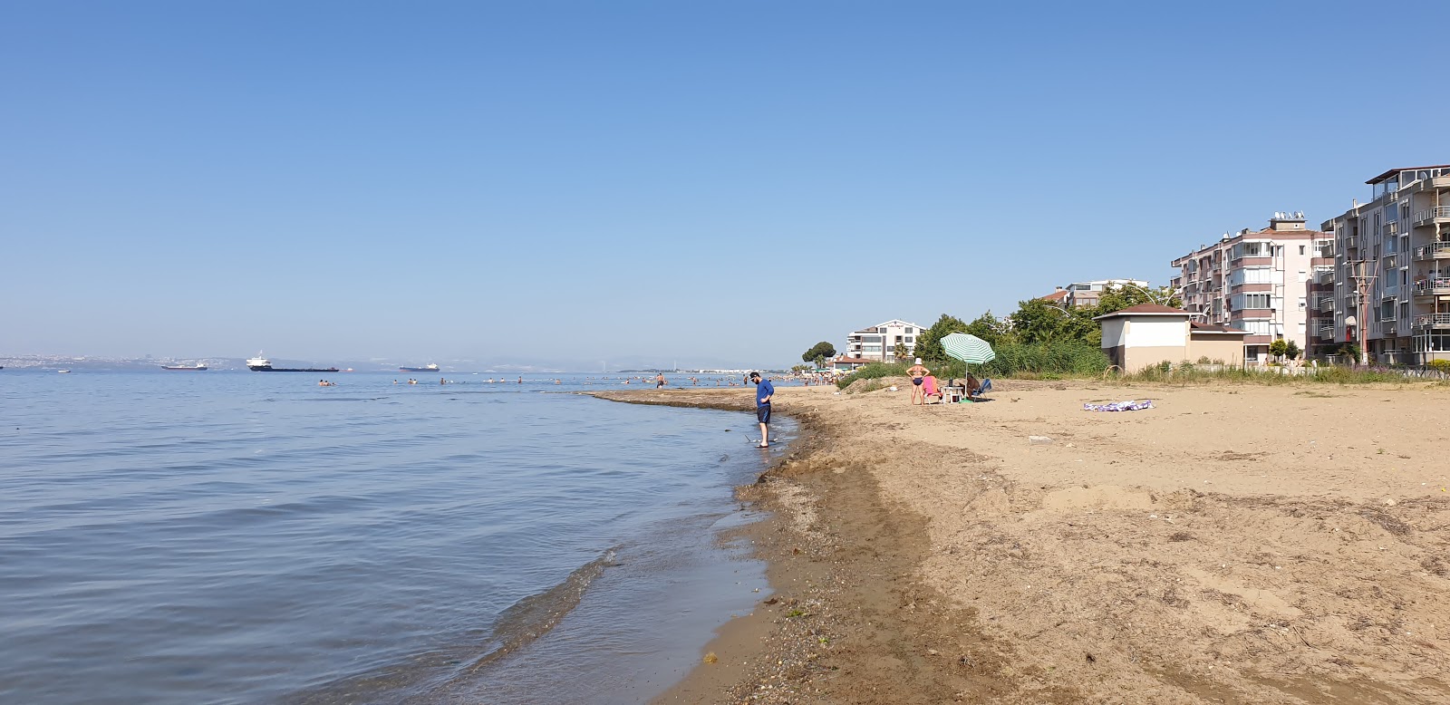 Foto van Dejavu beach met bruin zand oppervlakte