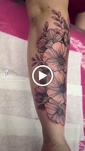 Explore tattoo ideas in french, creative tattoo ideas in Lake City, available at Crooked Spines Tattoo Studio