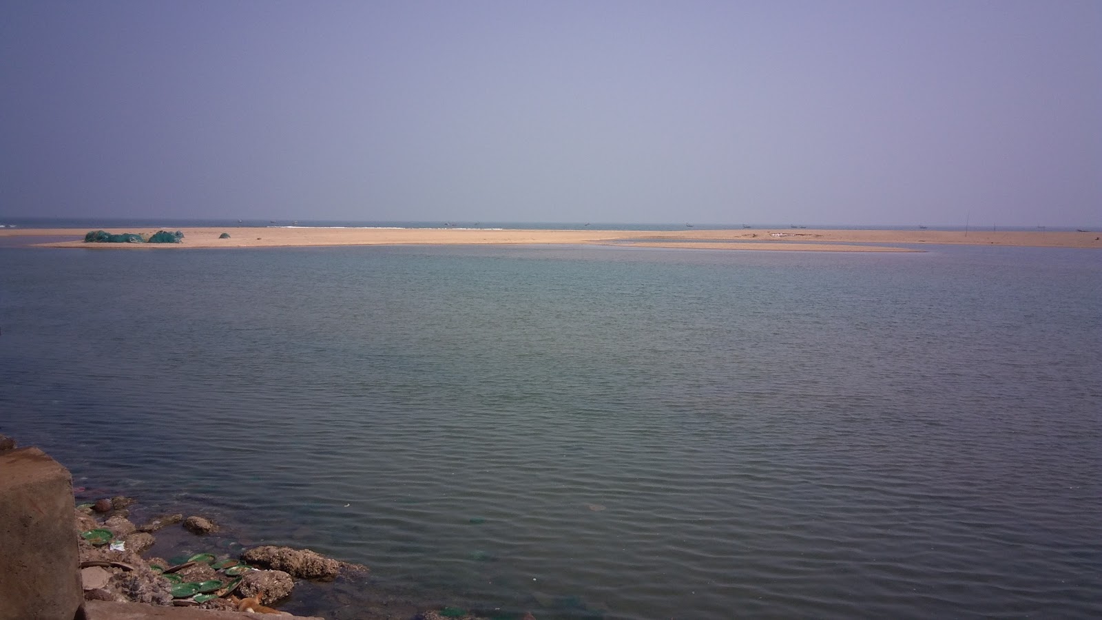 Fotografija Iddhivanipalem Beach z turkizna čista voda površino