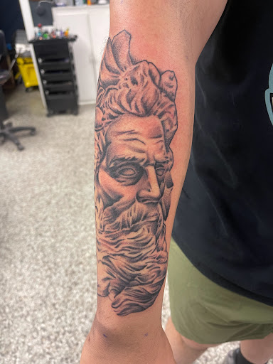 Explore mens knee tattoo ideas, creative tattoo ideas in Sanford, available at Luv Ink