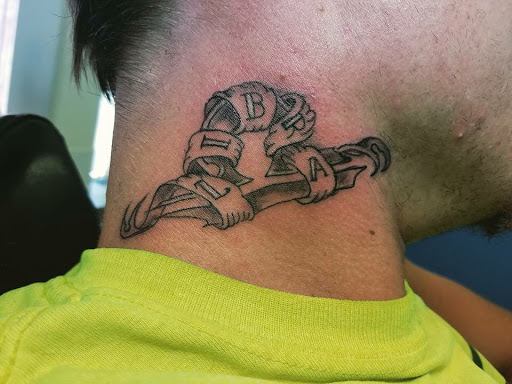 Explore wedding band tattoo ideas for him, creative tattoo ideas in Kearney, available at Babalus Professional Tattoo Studio